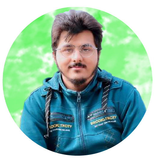 A man in a blue shirt with a happy expression